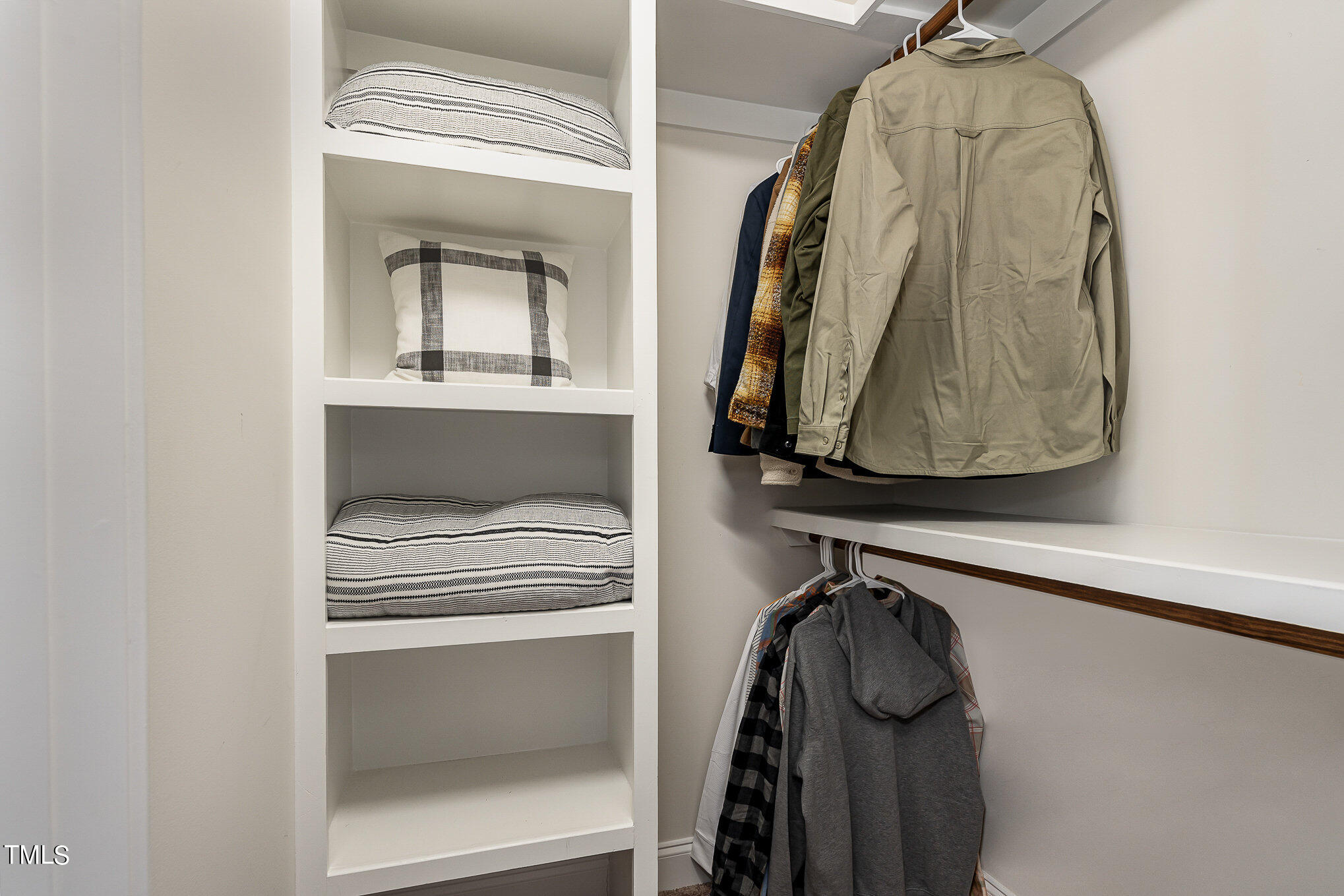 10632 Marion Stone Way Raleigh, NC 27614 - Photo 64 of 95 a view of walk in closet with clothes and shoes