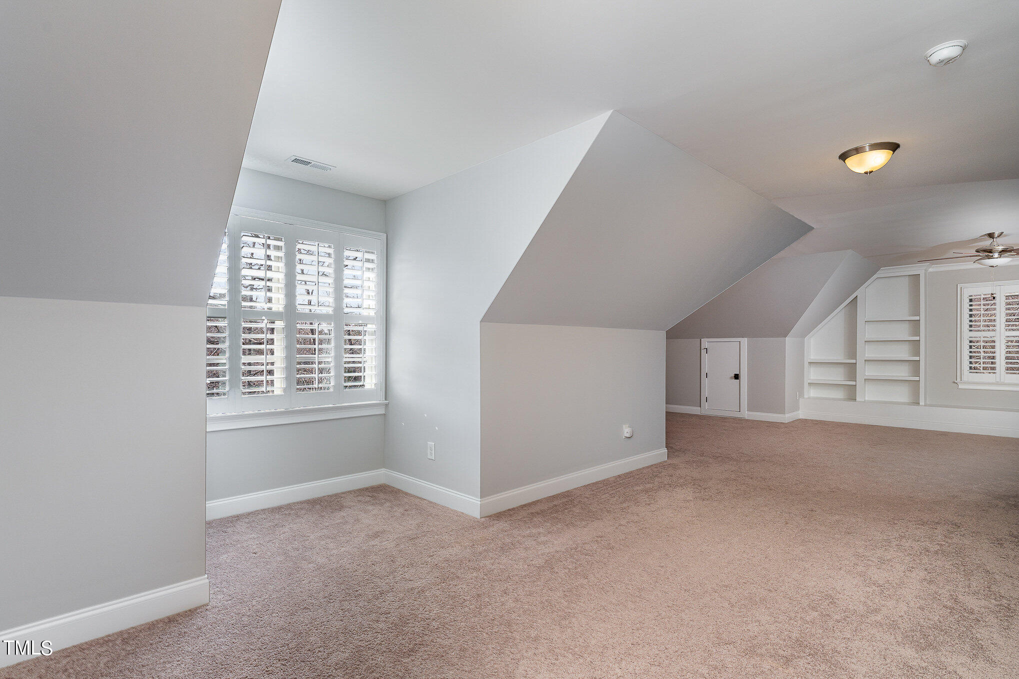 10632 Marion Stone Way Raleigh, NC 27614 - Photo 69 of 95 a view of an empty room with a window