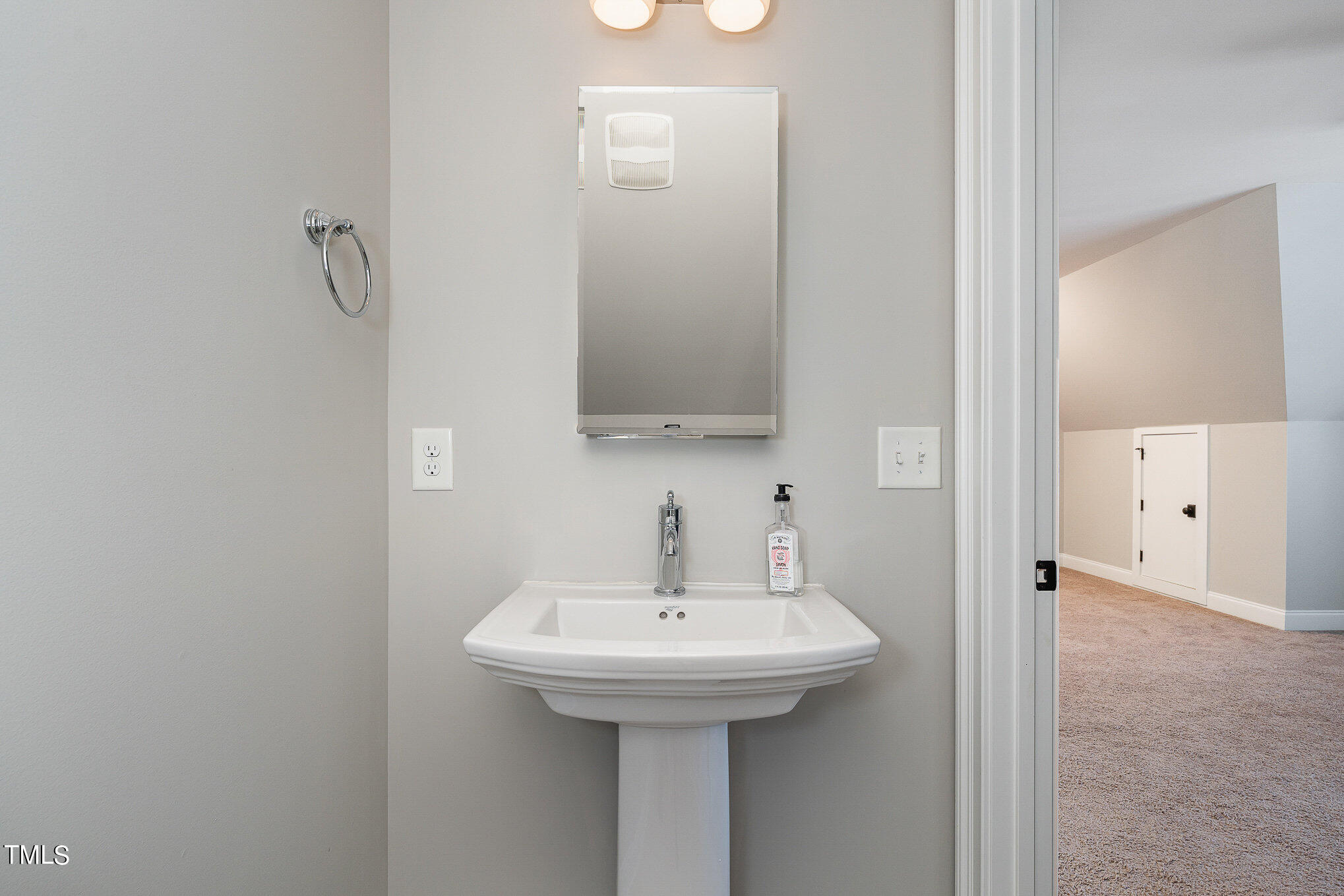 10632 Marion Stone Way Raleigh, NC 27614 - Photo 73 of 95 a bathroom with a sink and a mirror