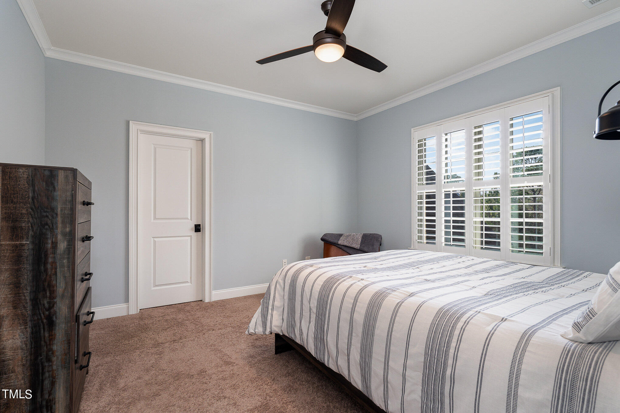 10632 Marion Stone Way Raleigh, NC 27614 - Photo 74 of 95 a bedroom with a bed closet and a window