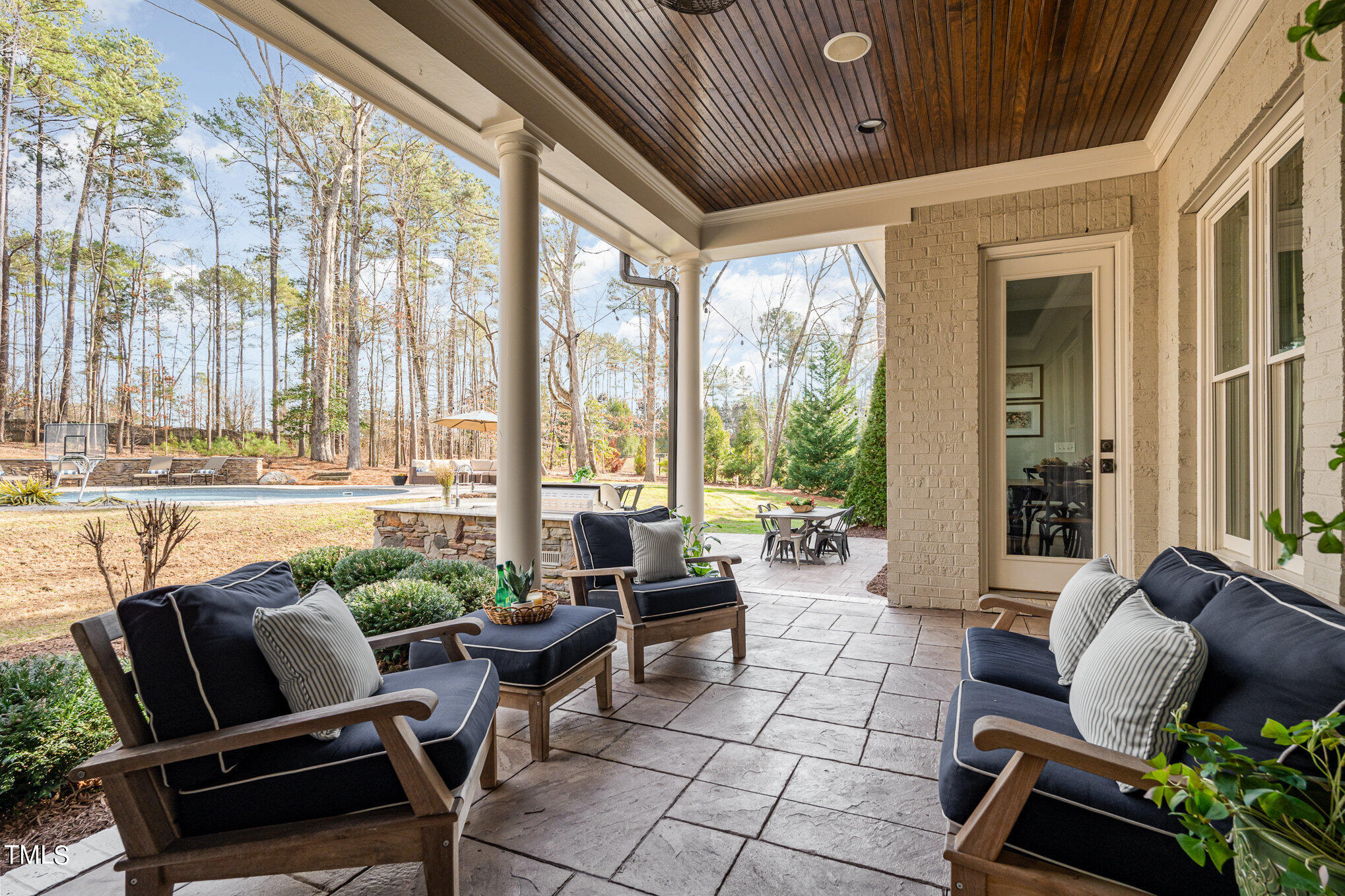 10632 Marion Stone Way Raleigh, NC 27614 - Photo 76 of 95 a outdoor living space with furniture and a floor to ceiling window