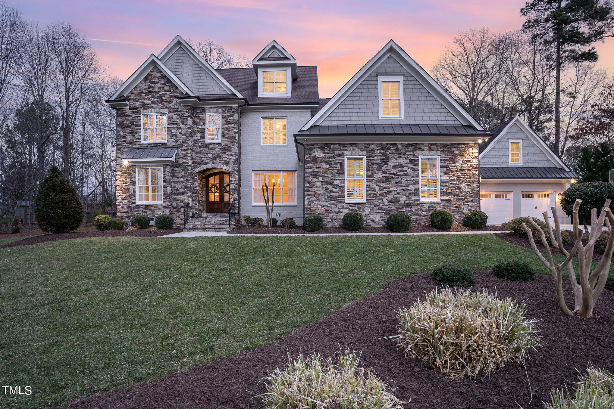 10632 Marion Stone Way Raleigh, NC 27614 - Photo 77 of 95 a front view of a house with a yard and garage