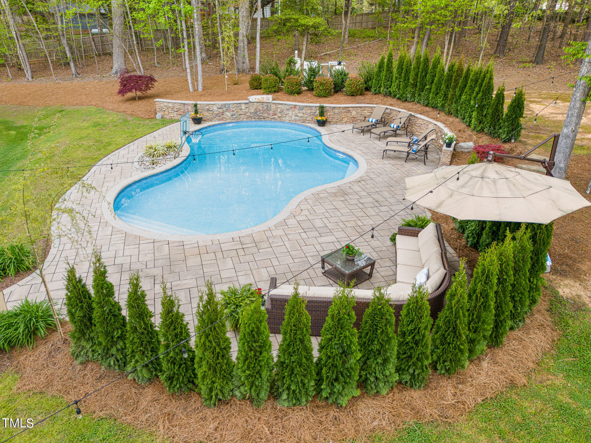 10632 Marion Stone Way Raleigh, NC 27614 - Photo 92 of 95 a view of a swimming pool with a patio and a yard
