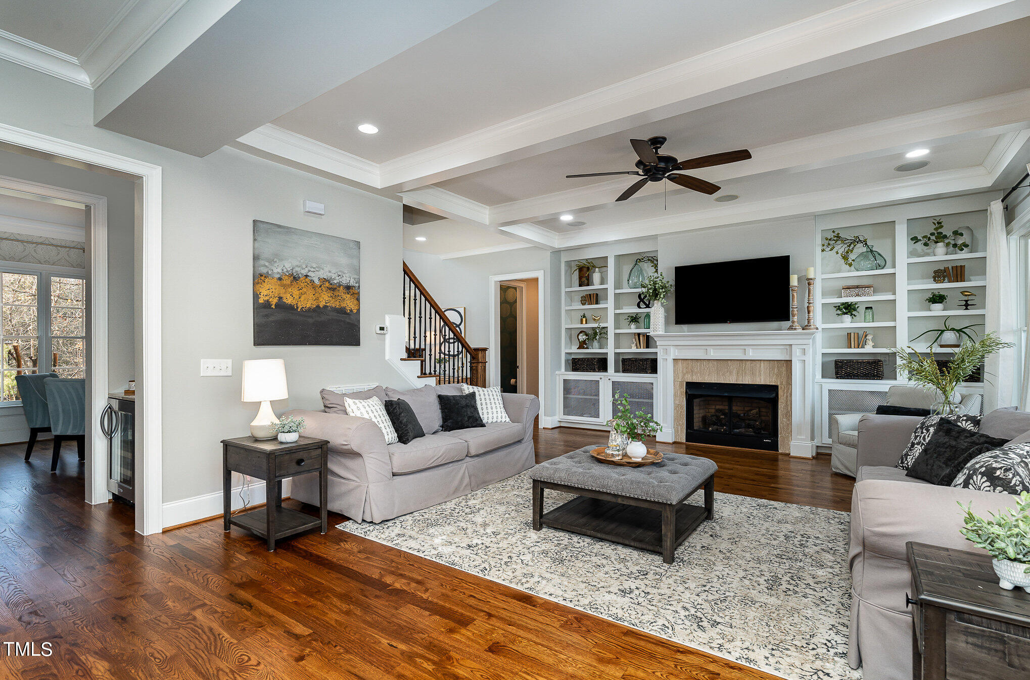 10632 Marion Stone Way Raleigh, NC 27614 - Photo 10 of 95 a living room with furniture a fireplace and a flat screen tv