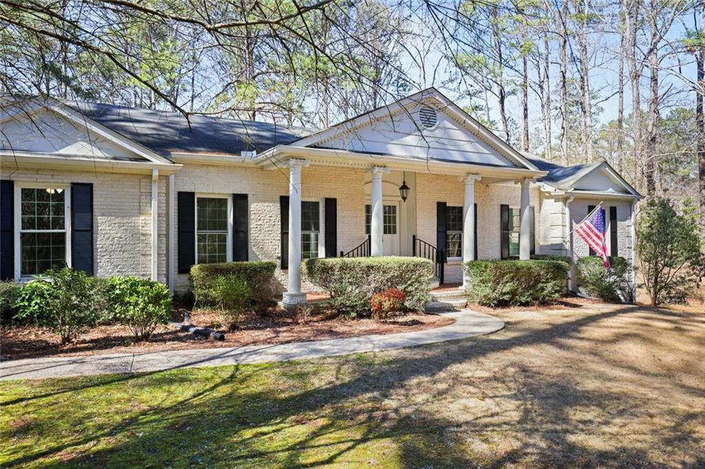 4505 Cochran Mill Road Fairburn, GA 30213 - Photo 2 of 36 a front view of a house with yard and outdoor seating