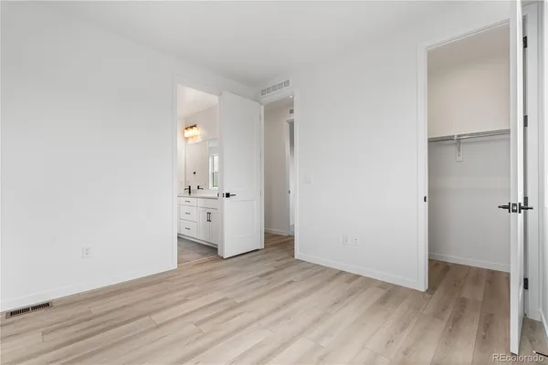 a view of a kitchen with wooden floor