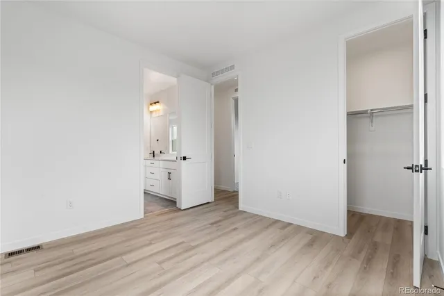 a view of a kitchen with wooden floor