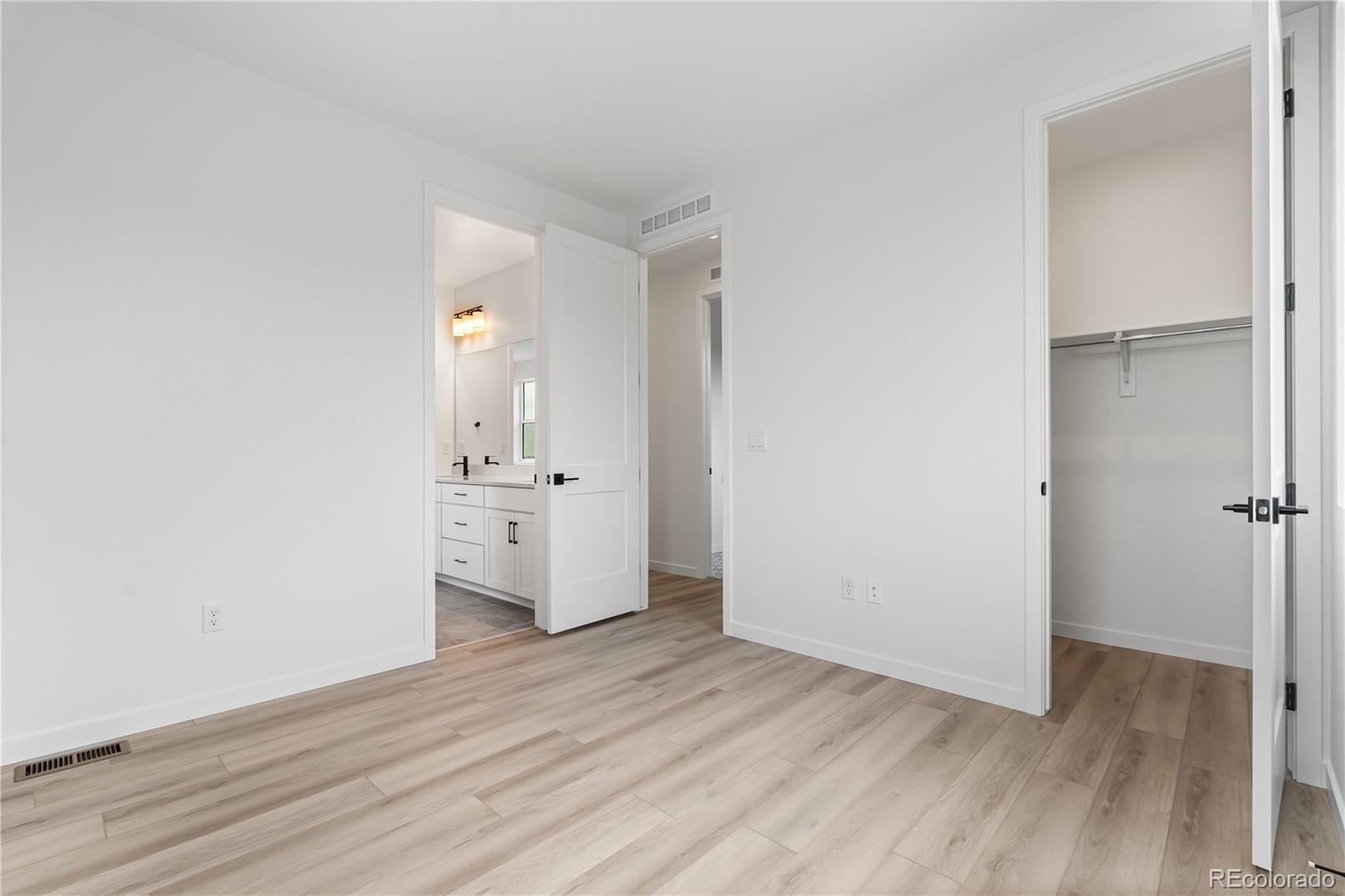 11972 Octave Avenue Lone Tree, CO 80134 - Photo 18 of 31 a view of a kitchen with wooden floor
