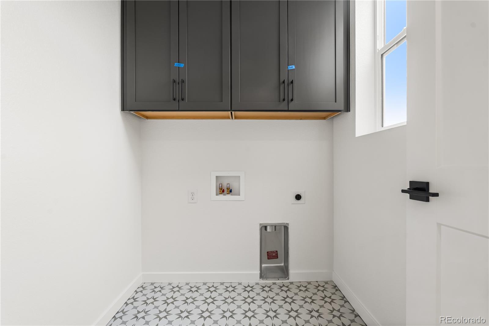 11972 Octave Avenue Lone Tree, CO 80134 - Photo 22 of 31 a bathroom with a window