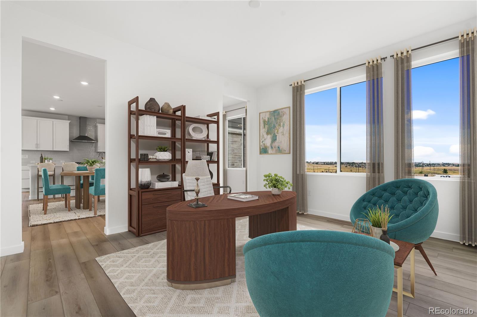 11972 Octave Avenue Lone Tree, CO 80134 - Photo 28 of 31 a living room with furniture a large window and wooden floor