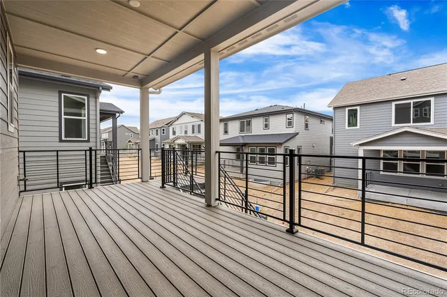 a view of a house with two chairs