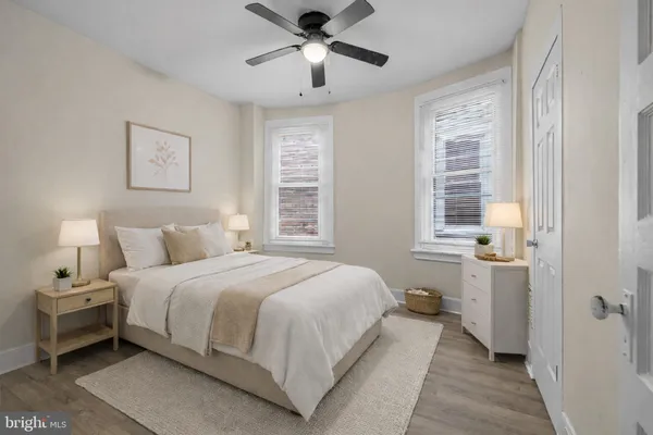 a bedroom with a bed and a window