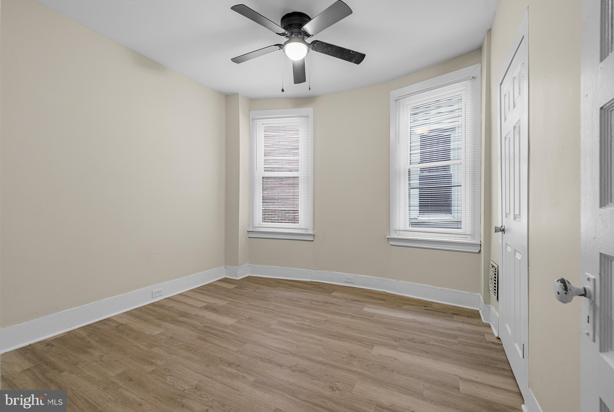 5723 Spruce Street, Unit 2 Philadelphia, PA 19139 - Photo 13 of 16 a view of empty room with wooden floor and fan