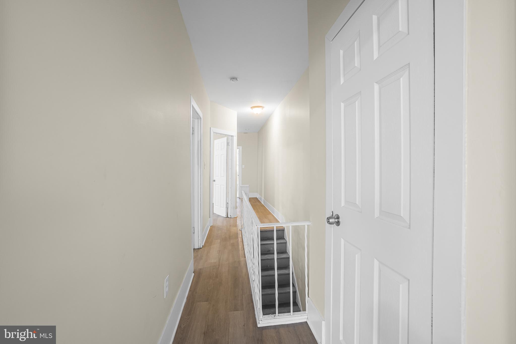 5723 Spruce Street, Unit 2 Philadelphia, PA 19139 - Photo 16 of 16 a view of a hallway with wooden floor and entryway
