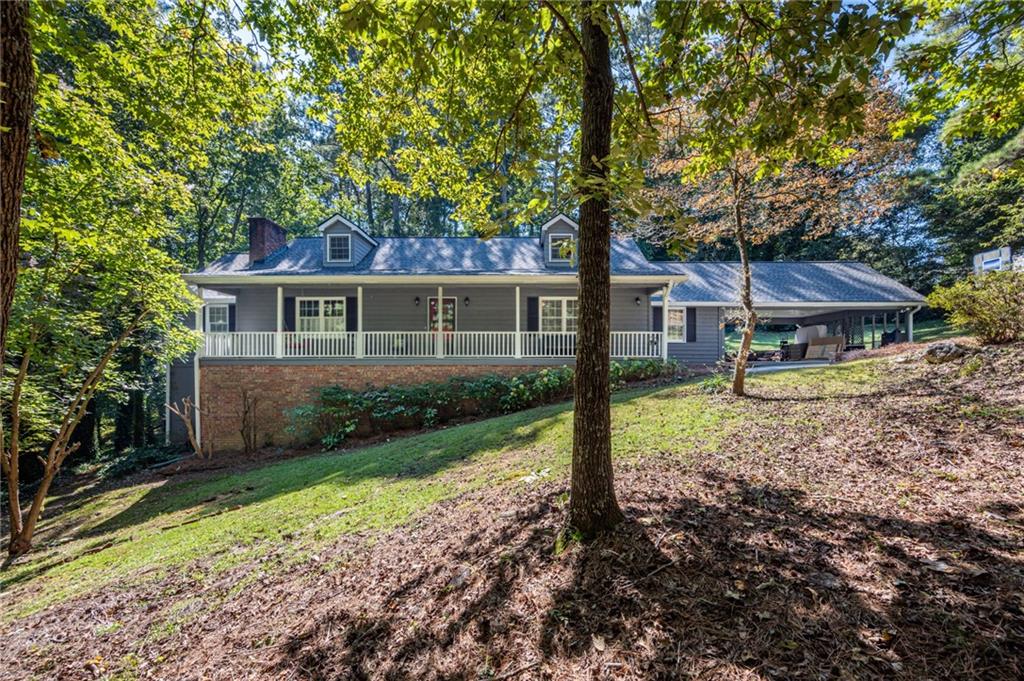 5 Cumberland Drive Southeast Rome, GA 30161 - Photo 1 of 1 a front view of a house with garden
