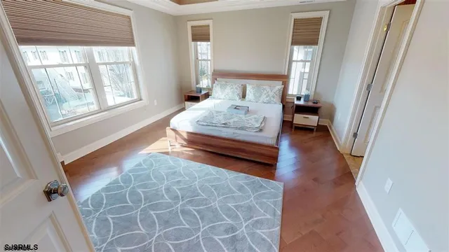 a bedroom with furniture and a window