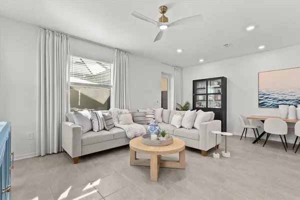 a kitchen with stainless steel appliances kitchen island granite countertop a refrigerator and a stove top oven