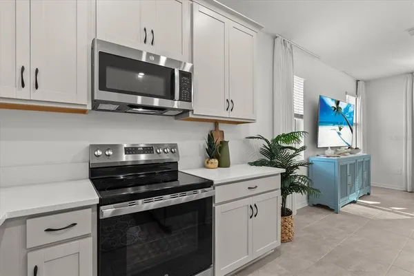 a bedroom with a bed and ceiling fan