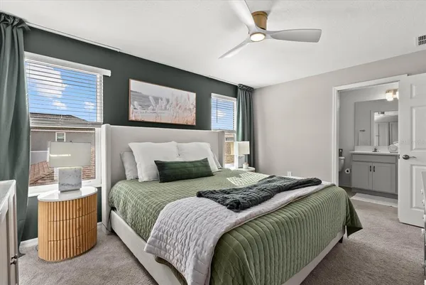 a bedroom with a bed and window