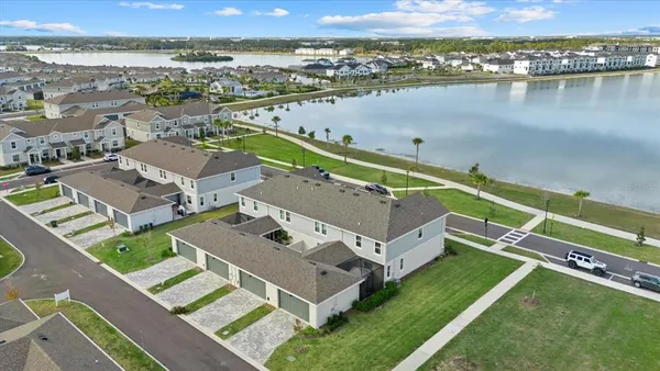 a view of a lake with a table chairs and a table