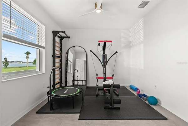 a view of a dining room with furniture and window
