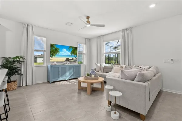 a kitchen with white cabinets and appliances