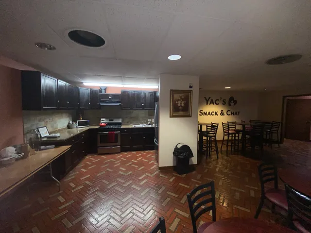 a room with lots of furniture and white walls