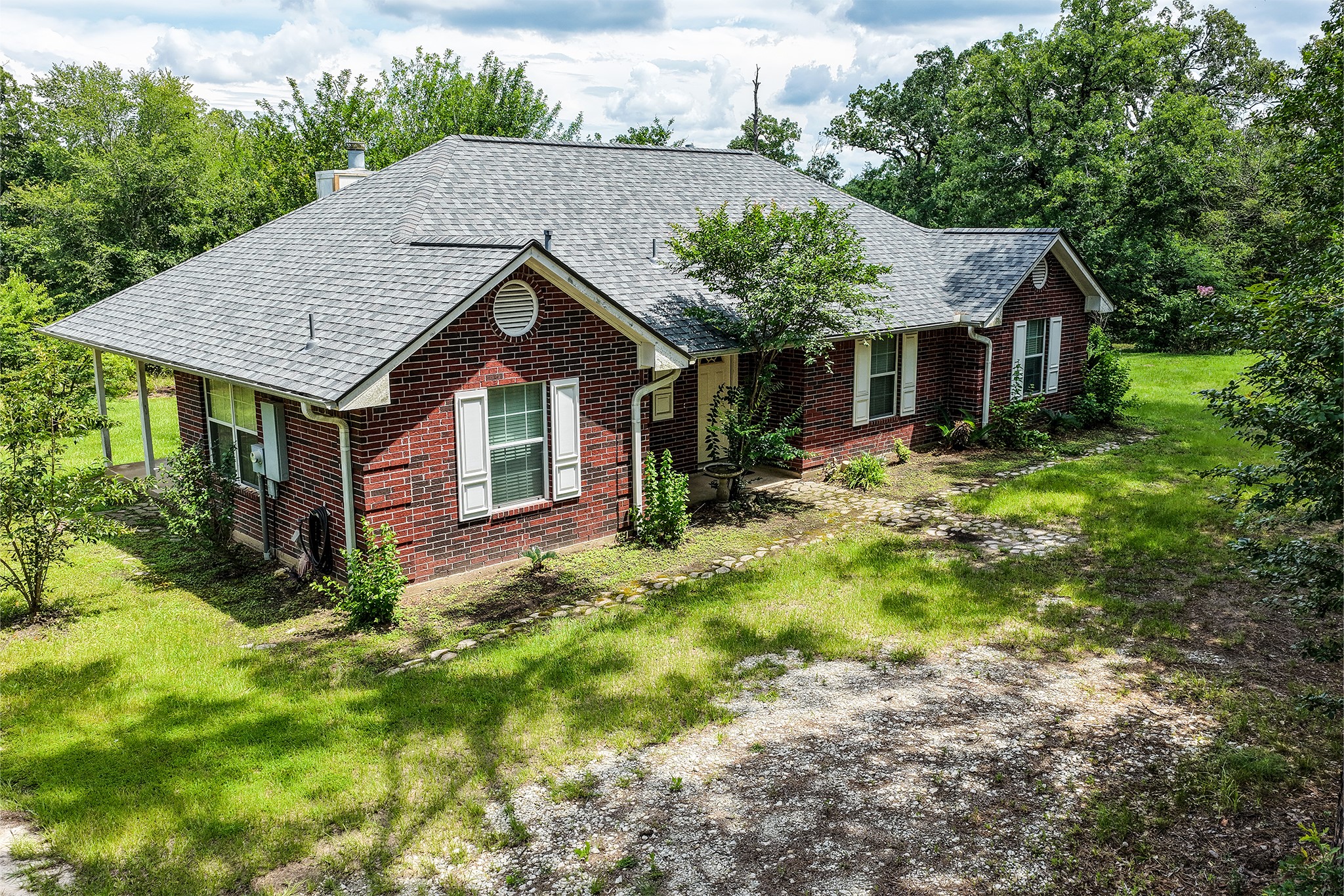 691 Bishop Road Huntsville, TX 77320 - Photo 1 of 32 a front view of house with yard and green space