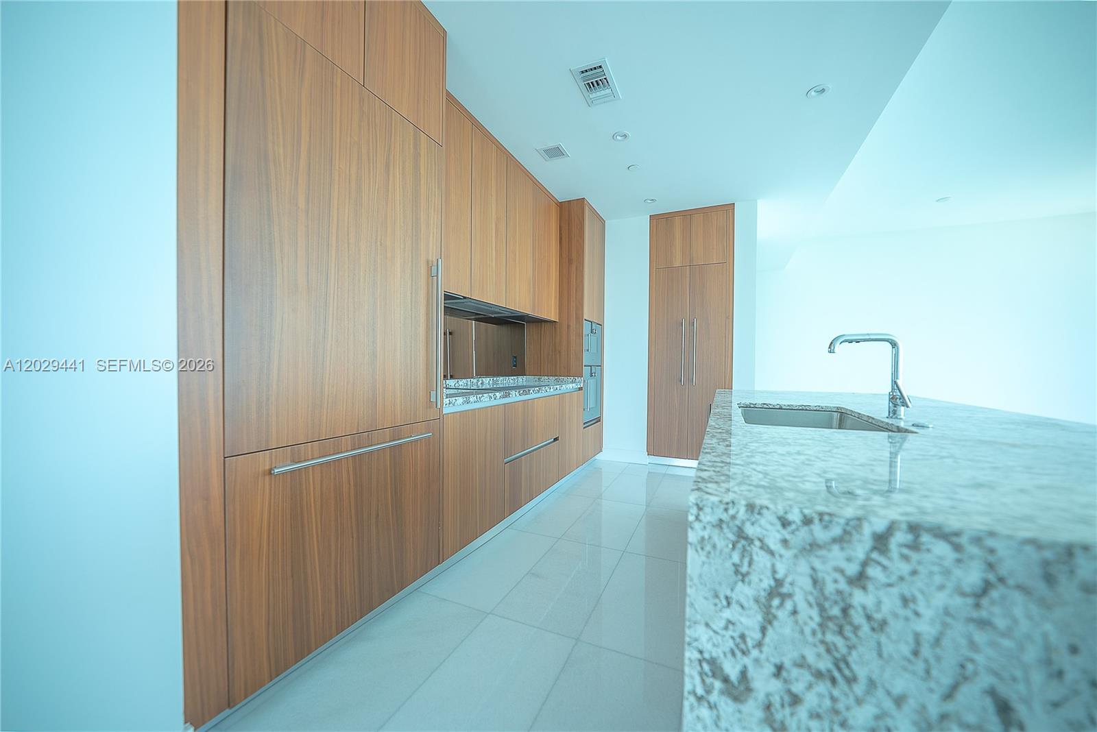 175 Southeast 25th Road, Unit 2103 Miami, FL 33129 - Photo 5 of 27 a view of a kitchen with a sink