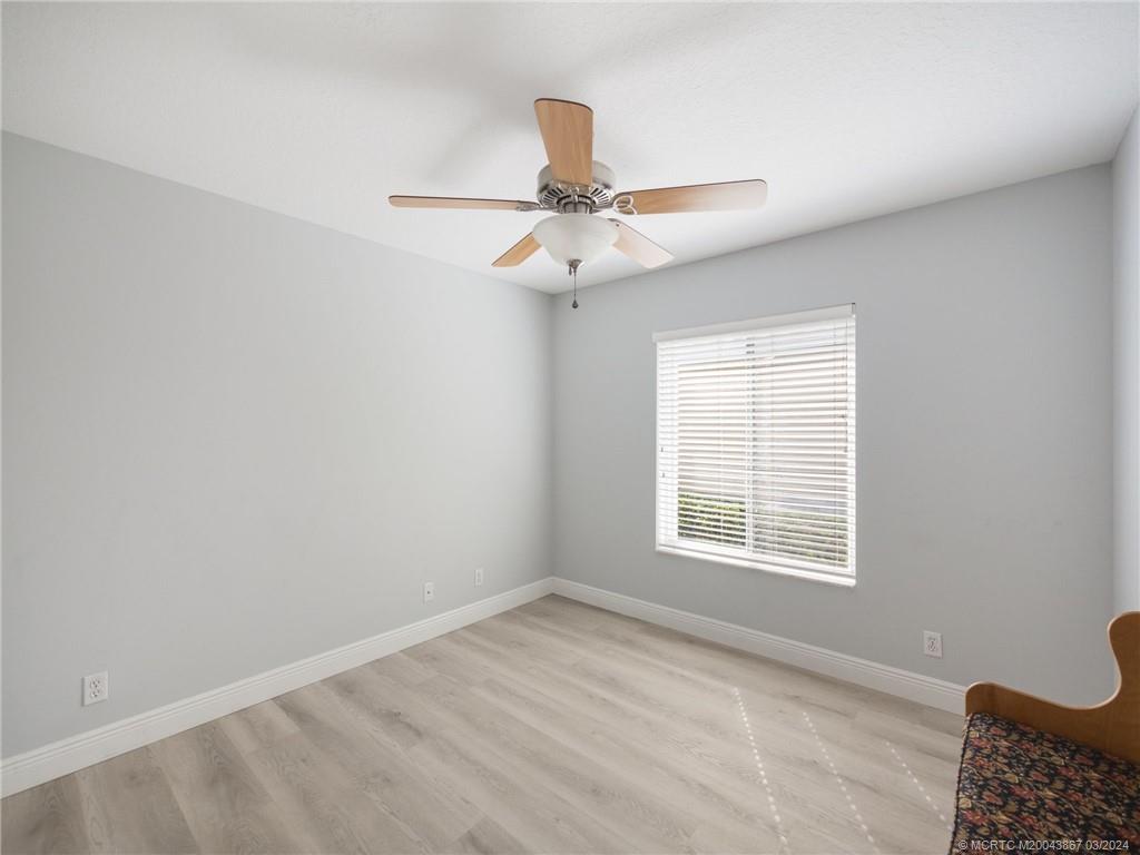 2432 Southeast Springtree Place Stuart, FL 34997 - Photo 19 of 24 a view of an empty room with a window