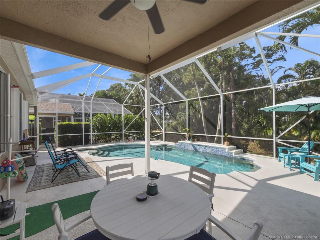 2432 Southeast Springtree Place Stuart, FL 34997 - Photo 22 of 24 a house view with a sitting space