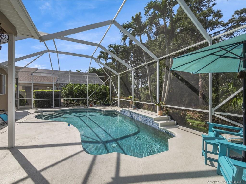 2432 Southeast Springtree Place Stuart, FL 34997 - Photo 24 of 24 a view of a house with backyard