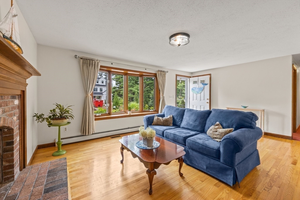 51 Poplar Drive Barnstable, MA 02655 - Photo 11 of 23 a living room with furniture and a large window