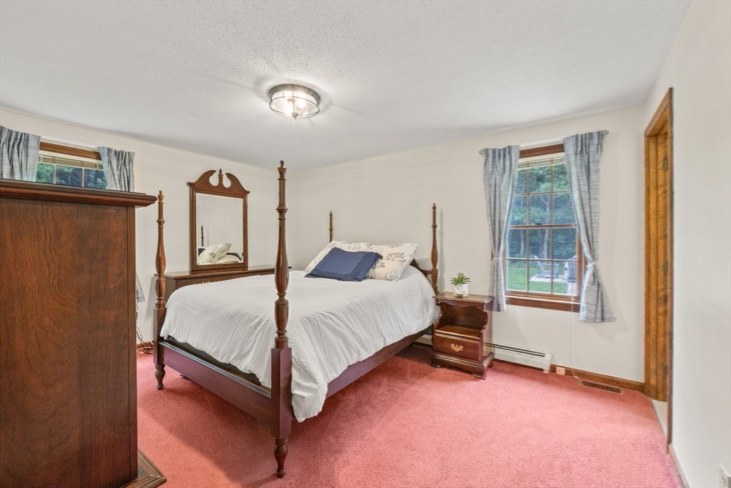 51 Poplar Drive Barnstable, MA 02655 - Photo 13 of 23 a spacious bedroom with a bed and window