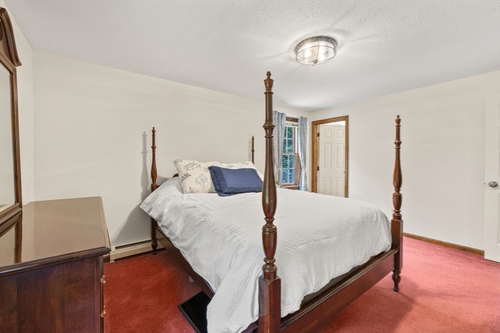 51 Poplar Drive Barnstable, MA 02655 - Photo 14 of 23 a bedroom with a bed and a night stand