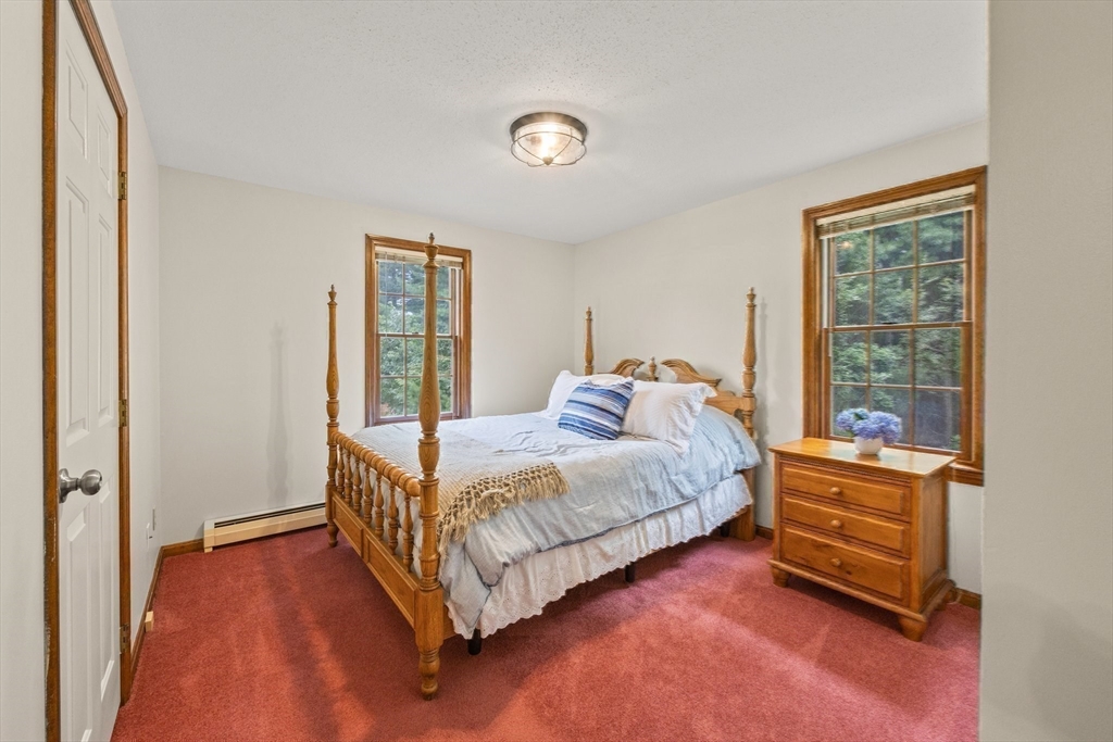 51 Poplar Drive Barnstable, MA 02655 - Photo 17 of 23 a bed sitting in a bedroom next to a window
