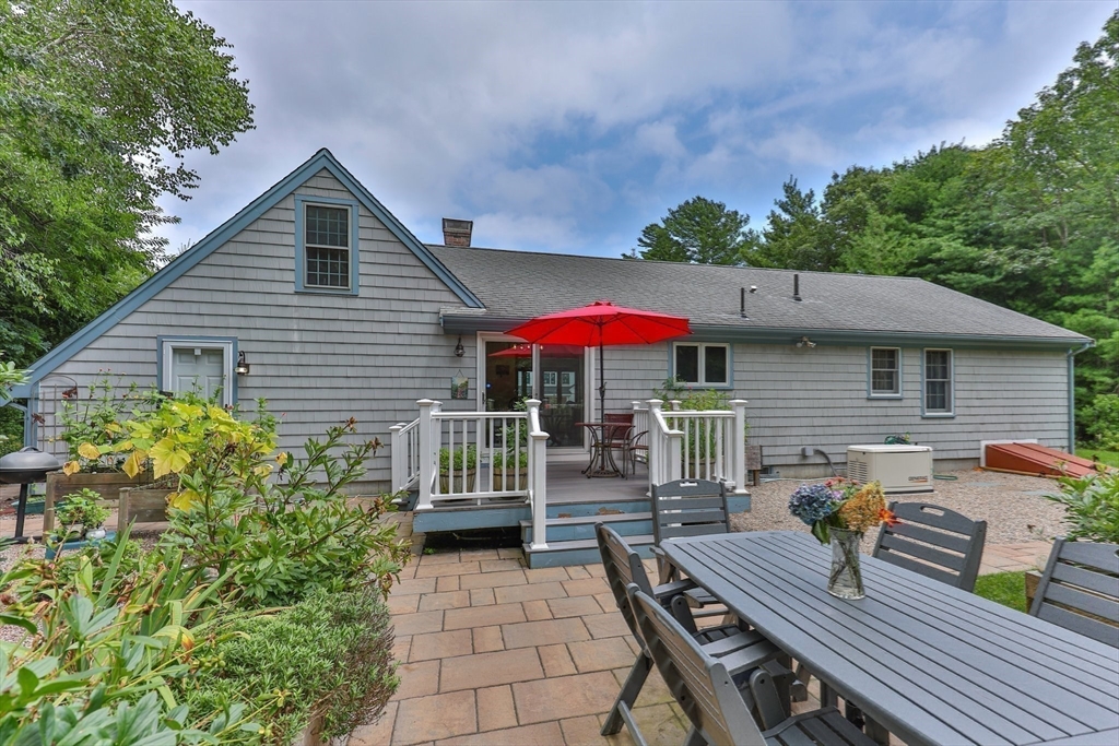 51 Poplar Drive Barnstable, MA 02655 - Photo 2 of 23 a view of a house with wooden deck and furniture