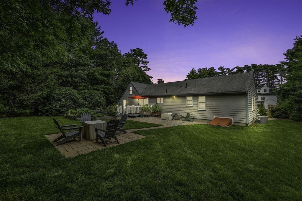 51 Poplar Drive Barnstable, MA 02655 - Photo 21 of 23 a front view of a house with patio and garden