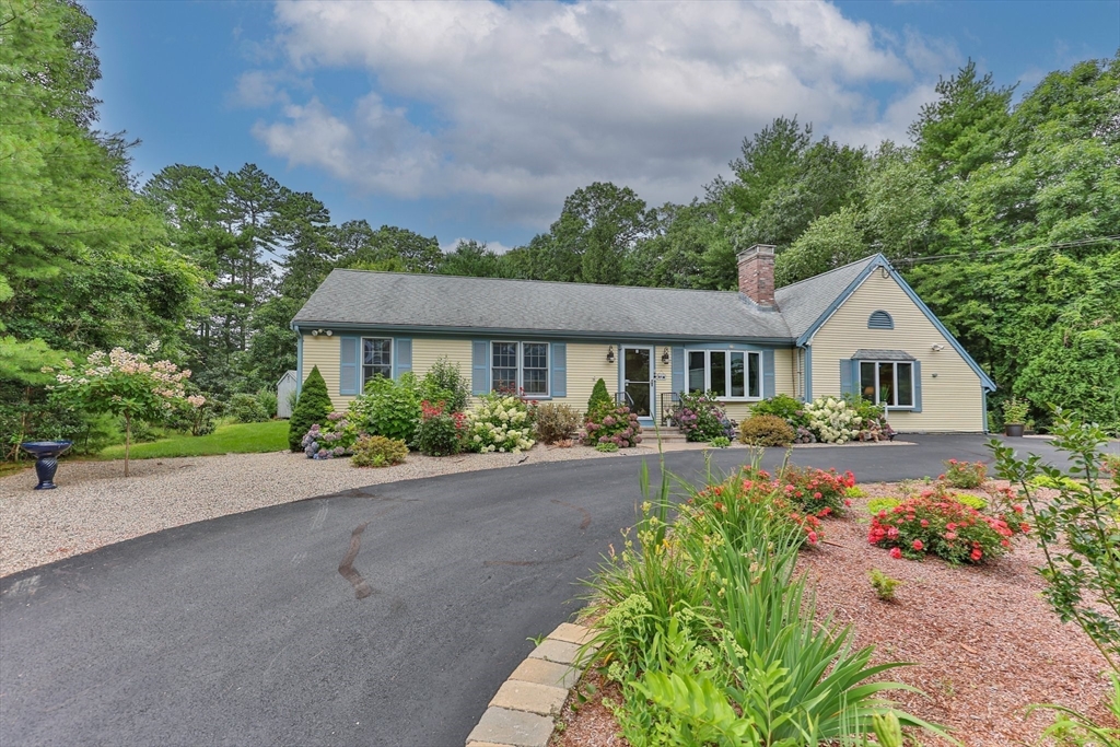51 Poplar Drive Barnstable, MA 02655 - Photo 3 of 23 a front view of a house with garden