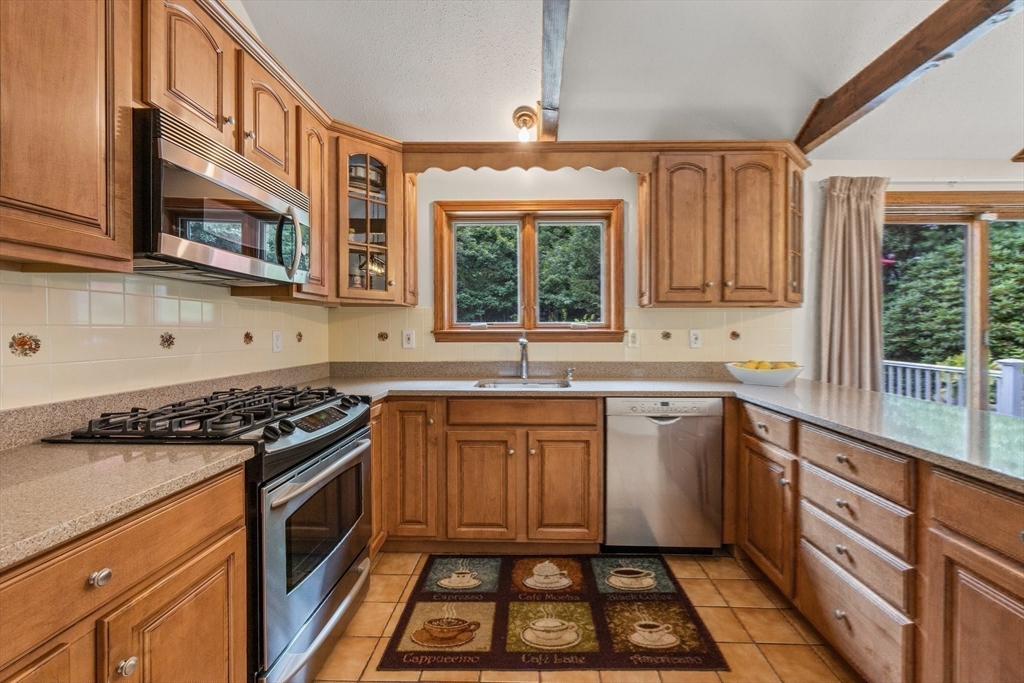 51 Poplar Drive Barnstable, MA 02655 - Photo 7 of 23 a kitchen with stainless steel appliances a stove sink and cabinets