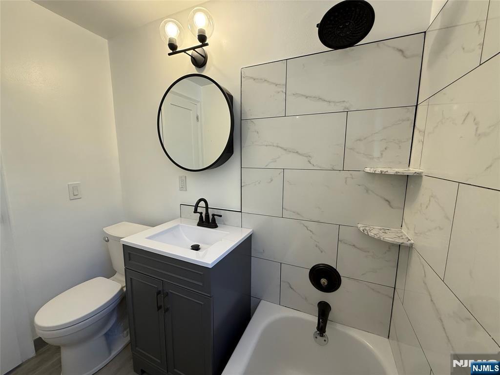 20 Clark Court Rutherford, NJ 07070 - Photo 15 of 29 a bathroom with a sink a toilet and a mirror