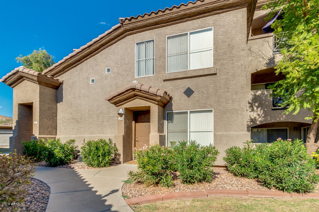 3236 East Chandler Boulevard, Unit 2093 Phoenix, AZ 85048 - Photo 19 of 28 a front view of a house with yard