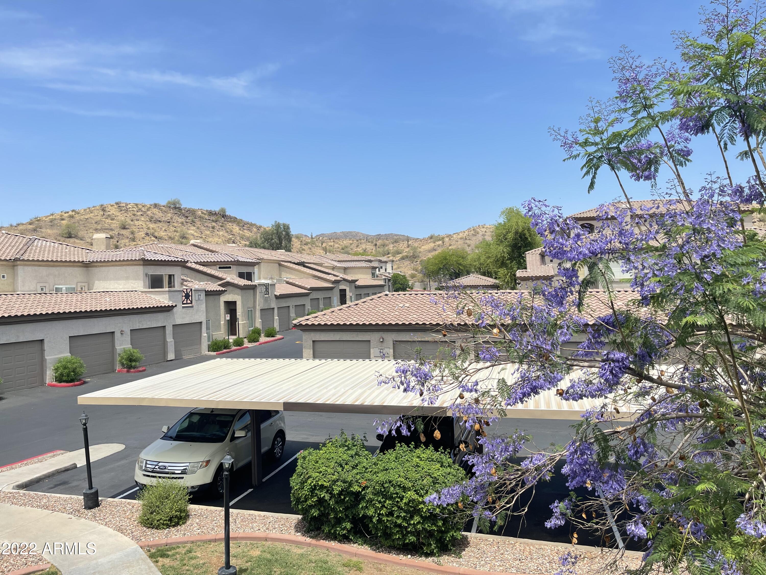 3236 East Chandler Boulevard, Unit 2093 Phoenix, AZ 85048 - Photo 22 of 28 a view of a house with a patio