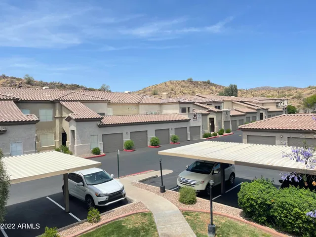 a aerial view of a house with swimming pool and sitting area