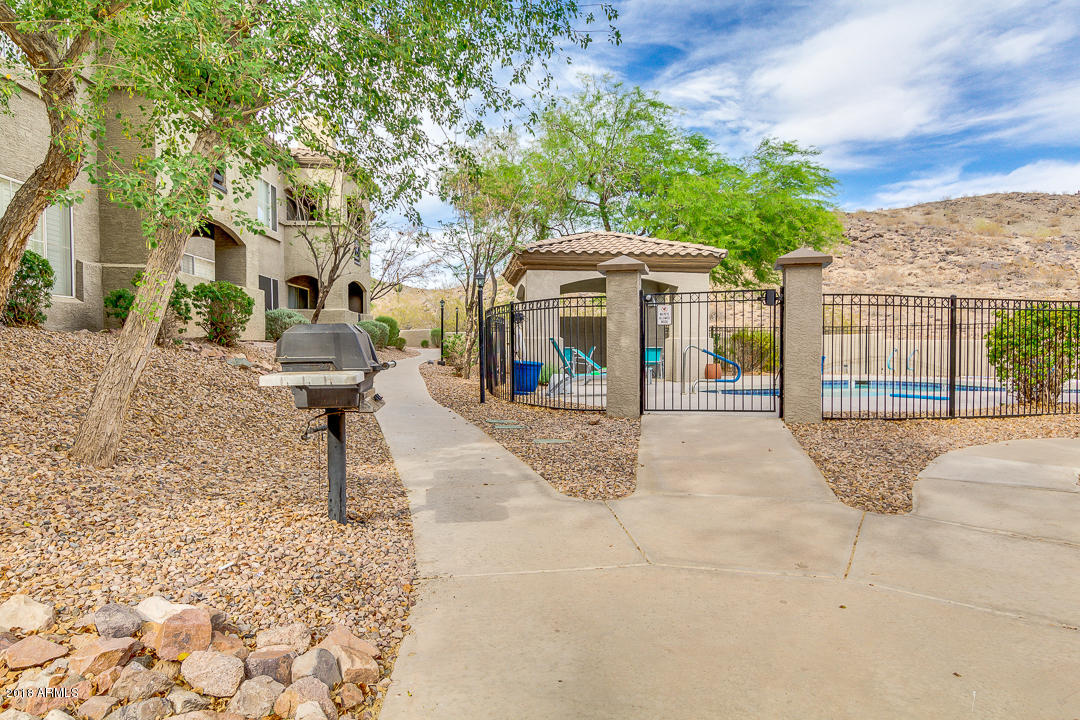 3236 East Chandler Boulevard, Unit 2093 Phoenix, AZ 85048 - Photo 26 of 28 a view of a building with a patio