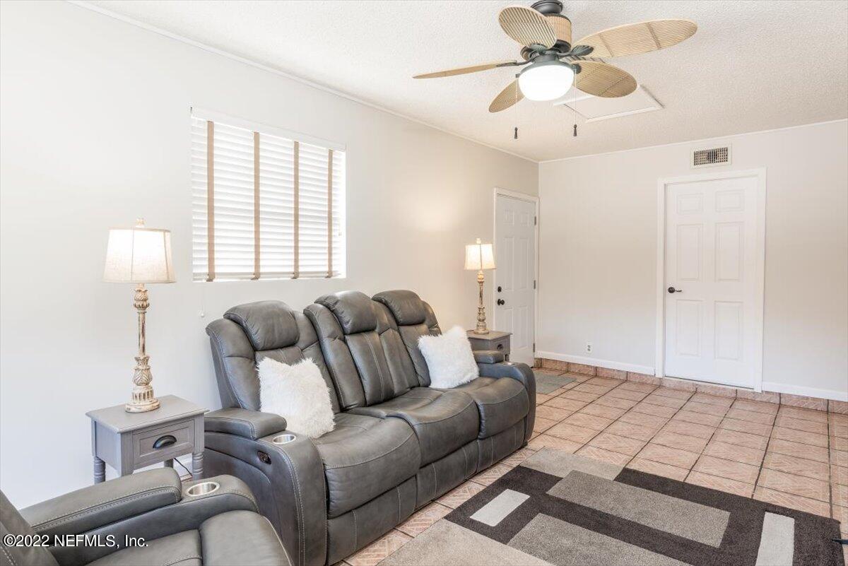 2124 Rothbury Drive Jacksonville, FL 32221 - Photo 12 of 27 a living room with furniture and a window