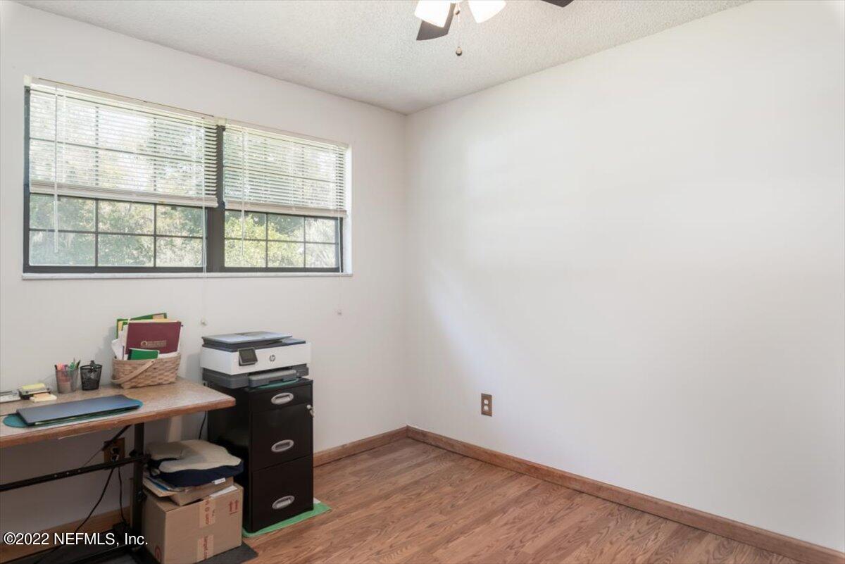 2124 Rothbury Drive Jacksonville, FL 32221 - Photo 17 of 27 a view of a workspace with furniture and a window