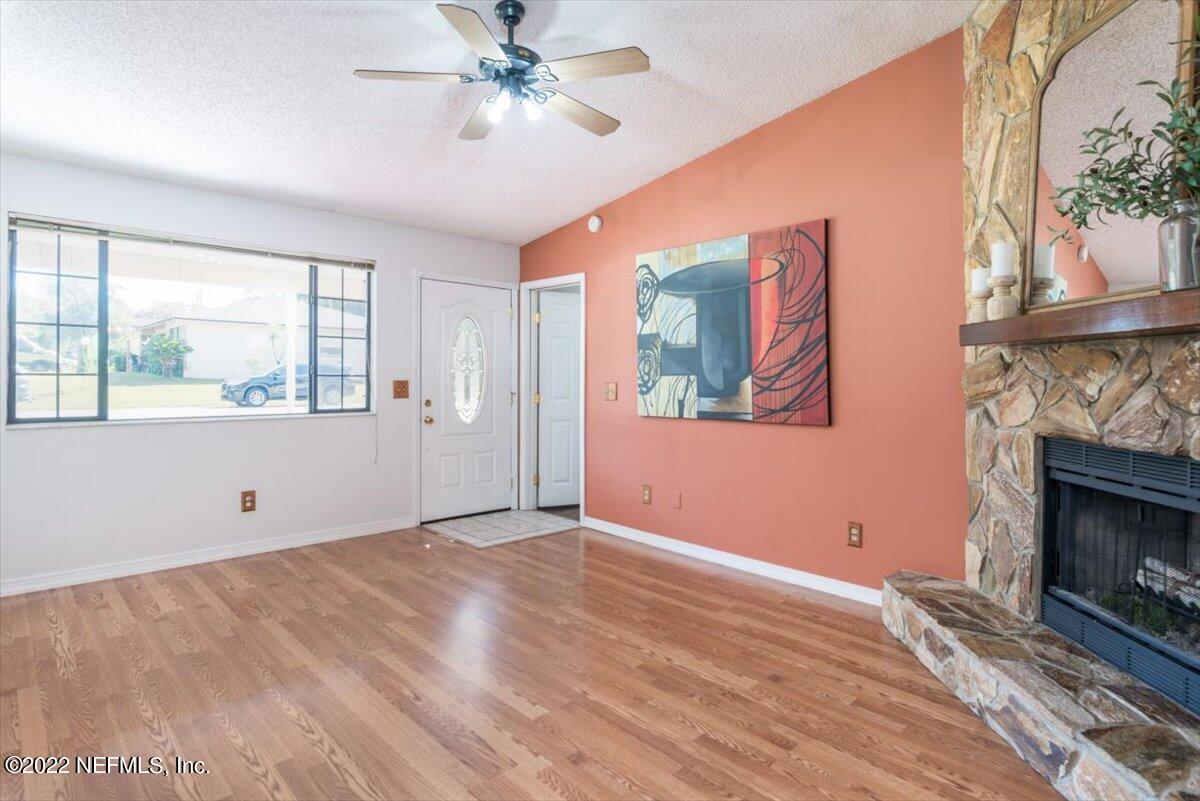 2124 Rothbury Drive Jacksonville, FL 32221 - Photo 5 of 27 a view of empty room with wooden floor and fan