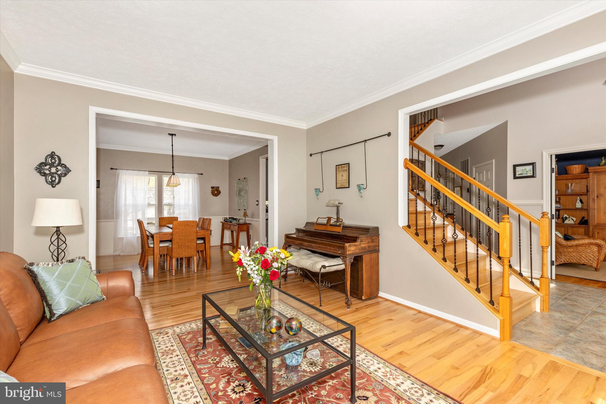6364 Claridge Drive North Frederick, MD 21701 - Photo 9 of 54 a living room with furniture a wooden floor and next to a window