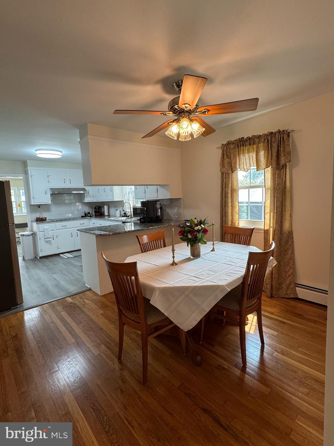 8 West Liberty Street Ridgely, MD 21660 - Photo 14 of 55 a view of a dining room with furniture window and wooden floor